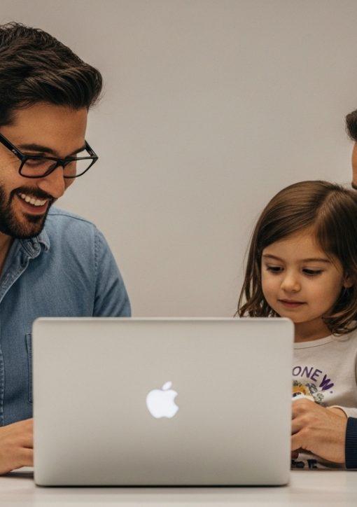 Parent using MacBook Neo at home with child nearby